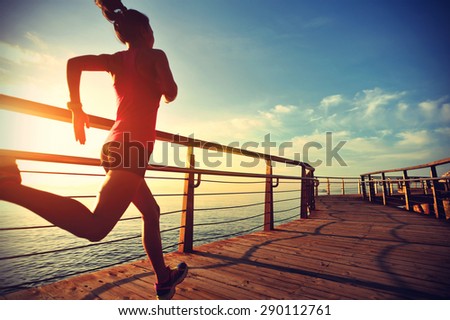 healthy lifestyle sports woman running on wooden boardwalk sunrise seaside ,vintage effect