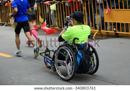 SHANGHAI,CHINA - NOVEMBER 08:Marathon runners running on city road at the 20th Shanghai Marathon NOVEMBER 08,2015 in Shanghai,China