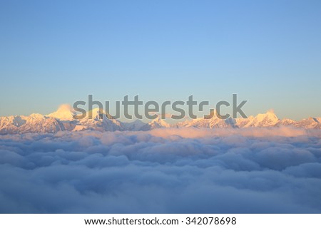 beautiful rolling clouds and sunrise snow mountain landscape