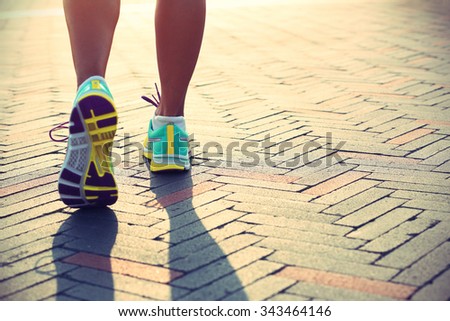 young fitness woman runner legs ready for a new start