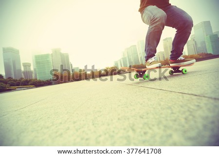 young skateboarder skateboarding at city