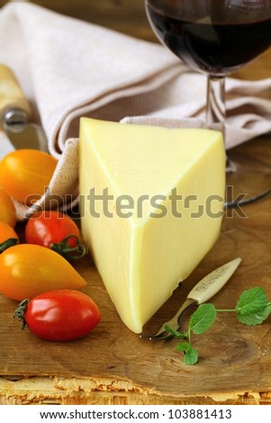piece of  cheese, tomato and cheese knife