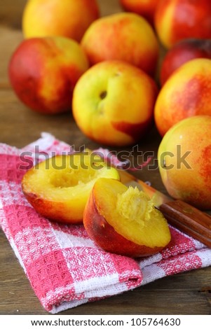 ripe red  peaches on wooden table