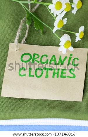 stack of colorful clothing with organic label