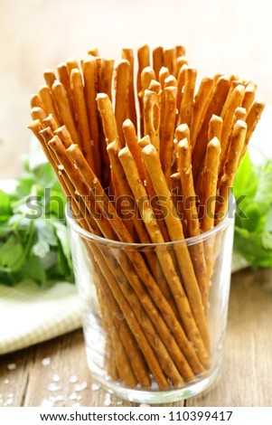 pretzels salty snack bread sticks in a glass on the table