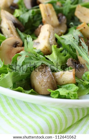 Fresh salad with arugula , grilled mushrooms