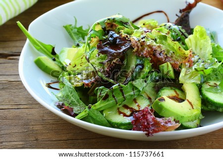 salad mix with avocado and cucumber,  with balsamic dressing