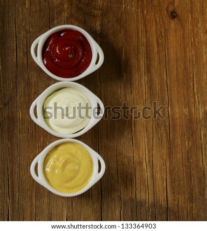 mustard, ketchup and mayonnaise - three kinds of sauces