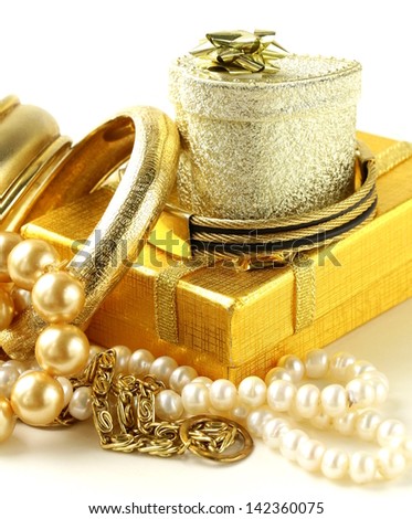 gold and pearl jewelry, gift boxes on a white background