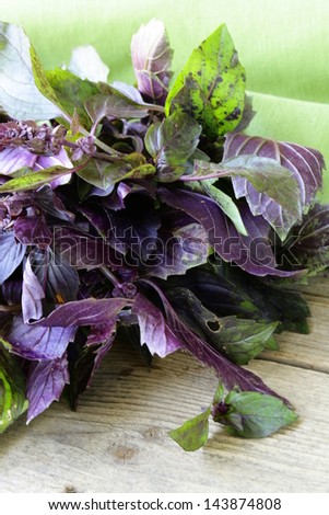 bunch of purple basil on a wooden table