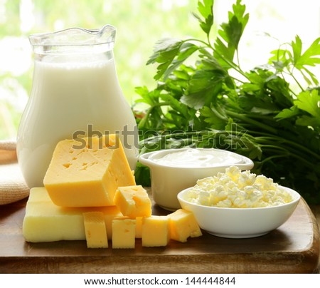 still life of dairy products (milk, sour cream, cheese, cottage cheese)