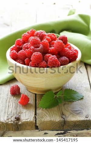 fresh organic ripe berry raspberry on a wooden table