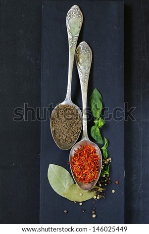 spice saffron and cumin in a vintage spoons