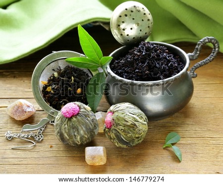assortment of tea - black leaf, green, exotic and tea strainers