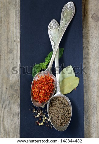 spice saffron and cumin in a vintage spoons