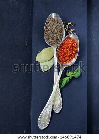 Spice Saffron And Cumin In A Vintage Spoons