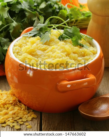 side dish of yellow lentils with herbs and spices