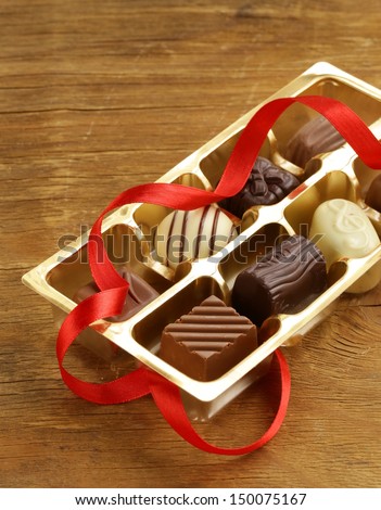 gift box of chocolate candies on a wooden background