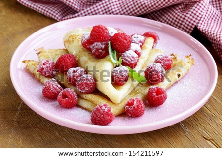 pancakes (crepes) with raspberries and mint -  healthy breakfast