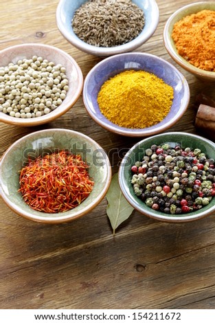 different kinds of spices in ceramic bowls