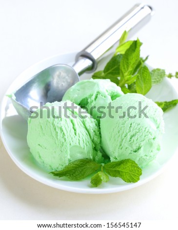 balls mint ice cream with fresh green herb
