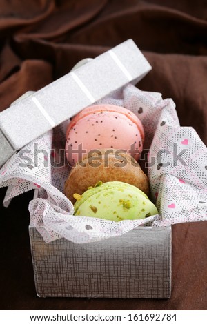 French multicolored macaroons in a gift box sweet present