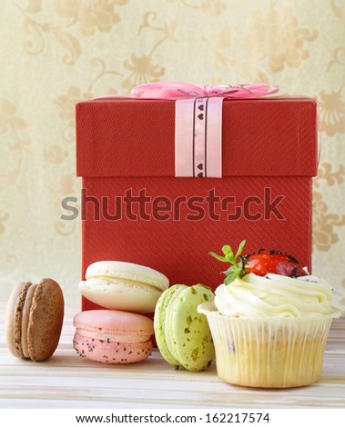 French multicolored macaroons with gift box sweet present