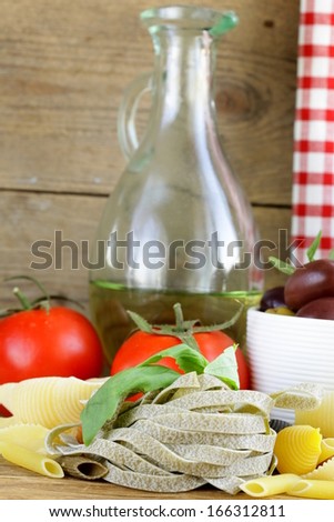 still life of Italian foods ( olive, oil, pasta, cheese )