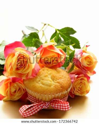 cake muffin with a bouquet of roses - sweet gift