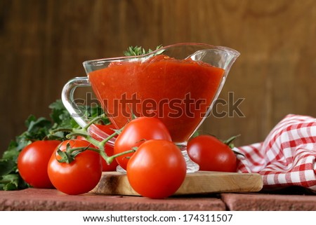 traditional tomato sauce in a glass gravy boat
