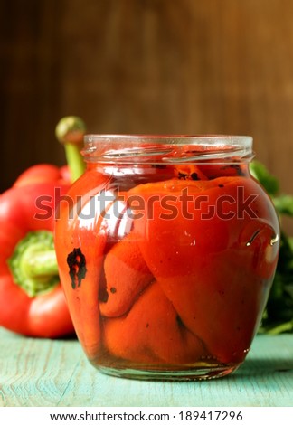 grilled red bell pepper in a glass jar
