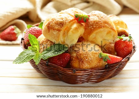 sweet muffins with strawberries and sugar - homemade pastries