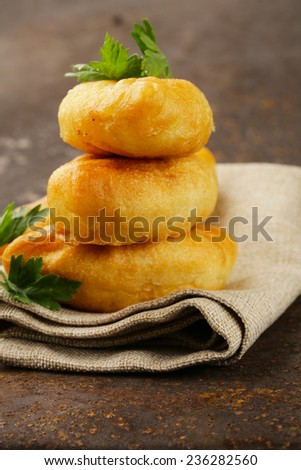 homemade fried pies with potatoes, rustic style