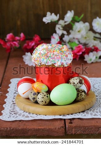 Easter cake with glace icing and colored easter eggs rustic style
