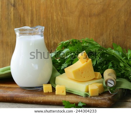milk and cheese on a wooden table, rustic style