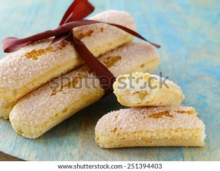 traditional Italian biscuit cookies savoryadi (for tiramisu) on a wooden table