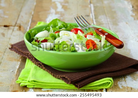 Easter spring salad with quail eggs, tomatoes and cucumbers