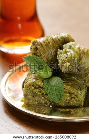 Turkish arabic dessert - baklava with honey and pistachios nuts