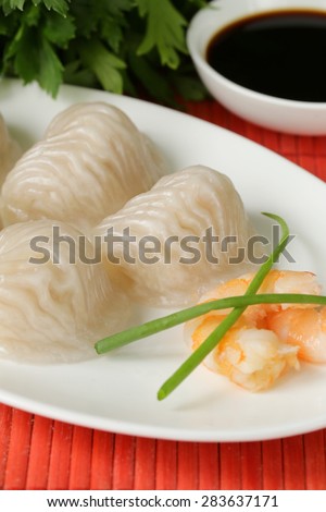Asian steamed meat dumplings dim sum with soy sauce