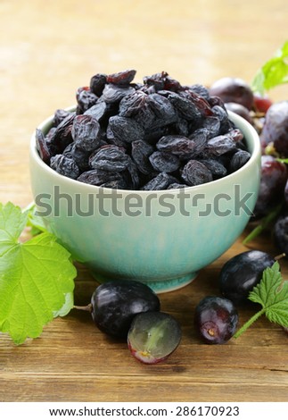 Natural organic dried grapes raisins, rustic still life