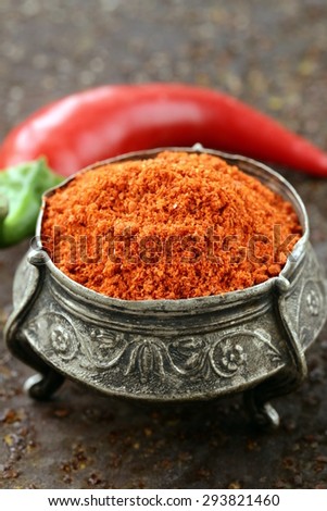 red spice paprika pepper on iron old background