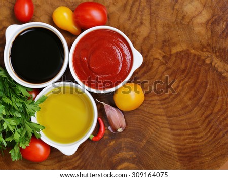 traditional Italian sauces - balsamic vinegar, tomato sauce and olive oil