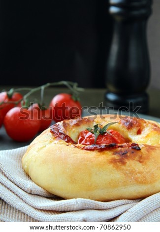 Italian pizza  bread with tomato and cheese on the board