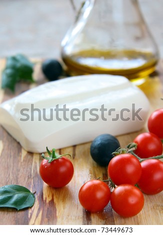 Ingredients for a Greek salad  feta cheese olives and butter, lettuce