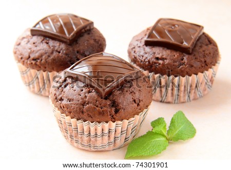 chocolate cupcake with chocolate decoration in pink packaging