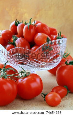 different varieties of tomatoes in a crystal vase