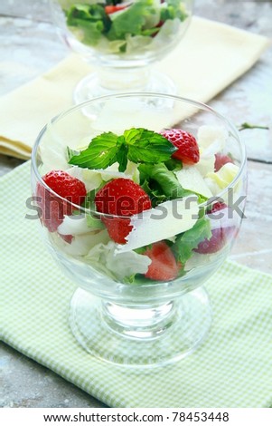 summer salad with strawberries, cheese and lettuce