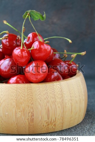 fresh organic ripe black cherry on a black background