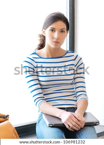 picture of calm and serious teenage girl with laptop