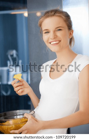 picture of happy and smiling teenage girl with chips